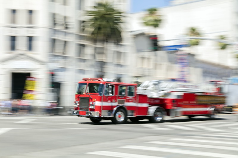 Firetruck speeding through intersection.