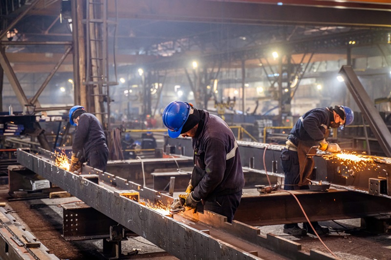 Three welders welding